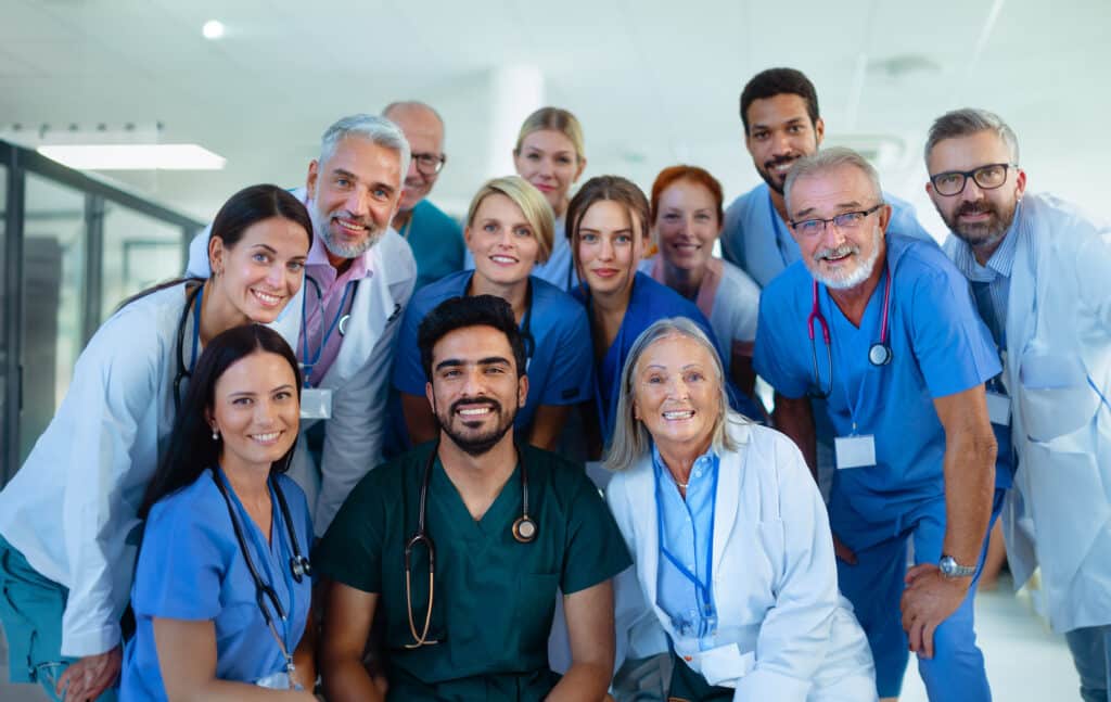 Portrait of happy doctors, nurses and other medical staff in a hospital.