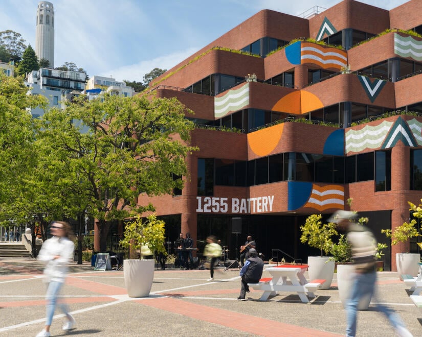 Pedestrians walk through Levis Plaza in San Francisco