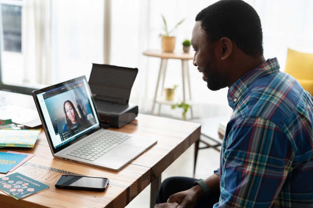 Career coaching guy on a laptop video call with a woman