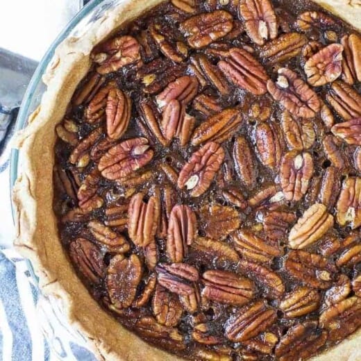 Whole pecan pie in the baking dish.