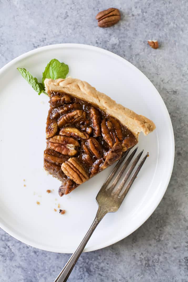 Slice of pecan pie recipe on a plate.