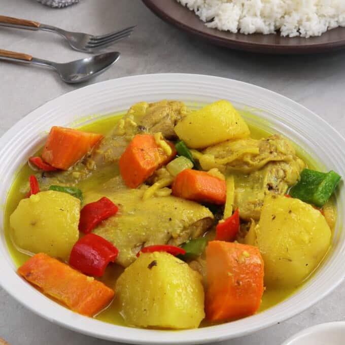 coconut chicken curry on a white serving plate