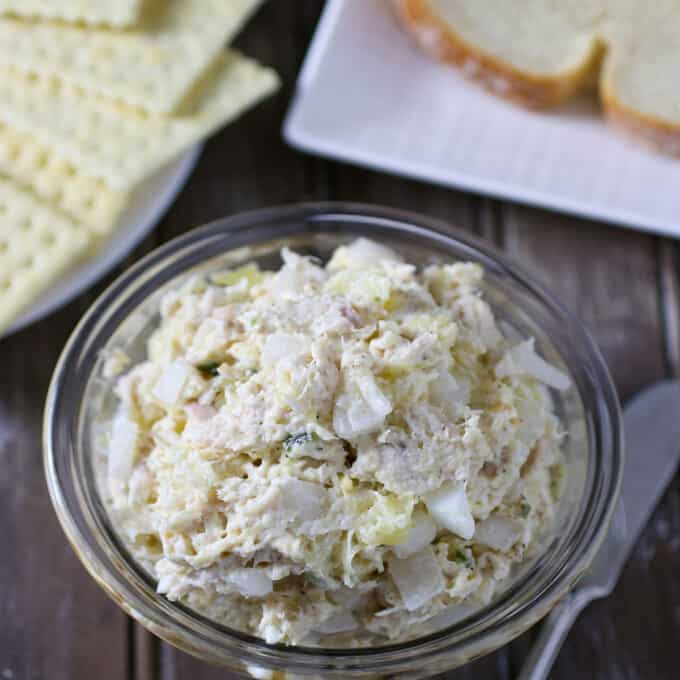 Chicken Salad Sandwich Spread in bowl with sliced bread on the side