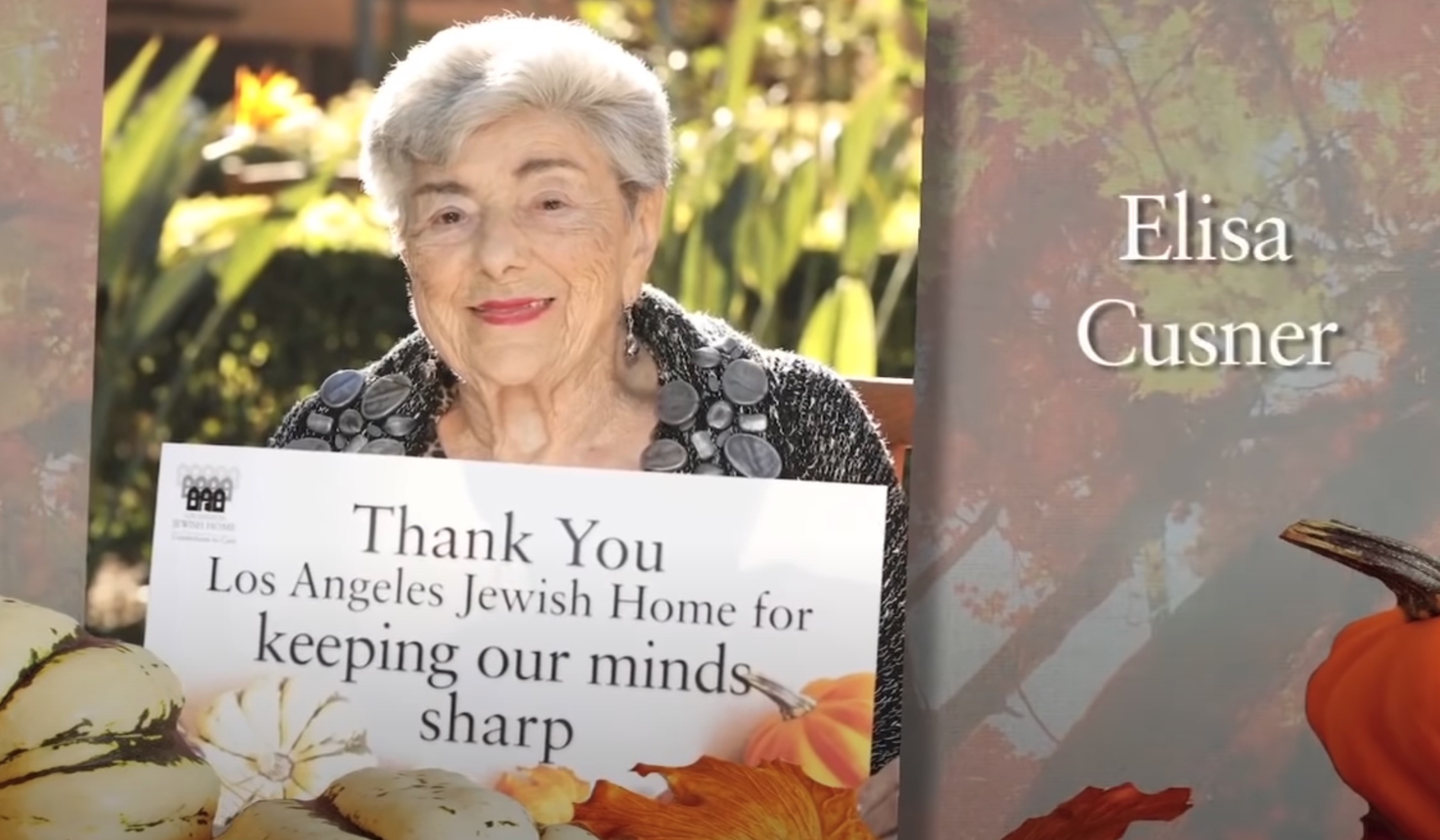 Woman holding a sign that says thank you