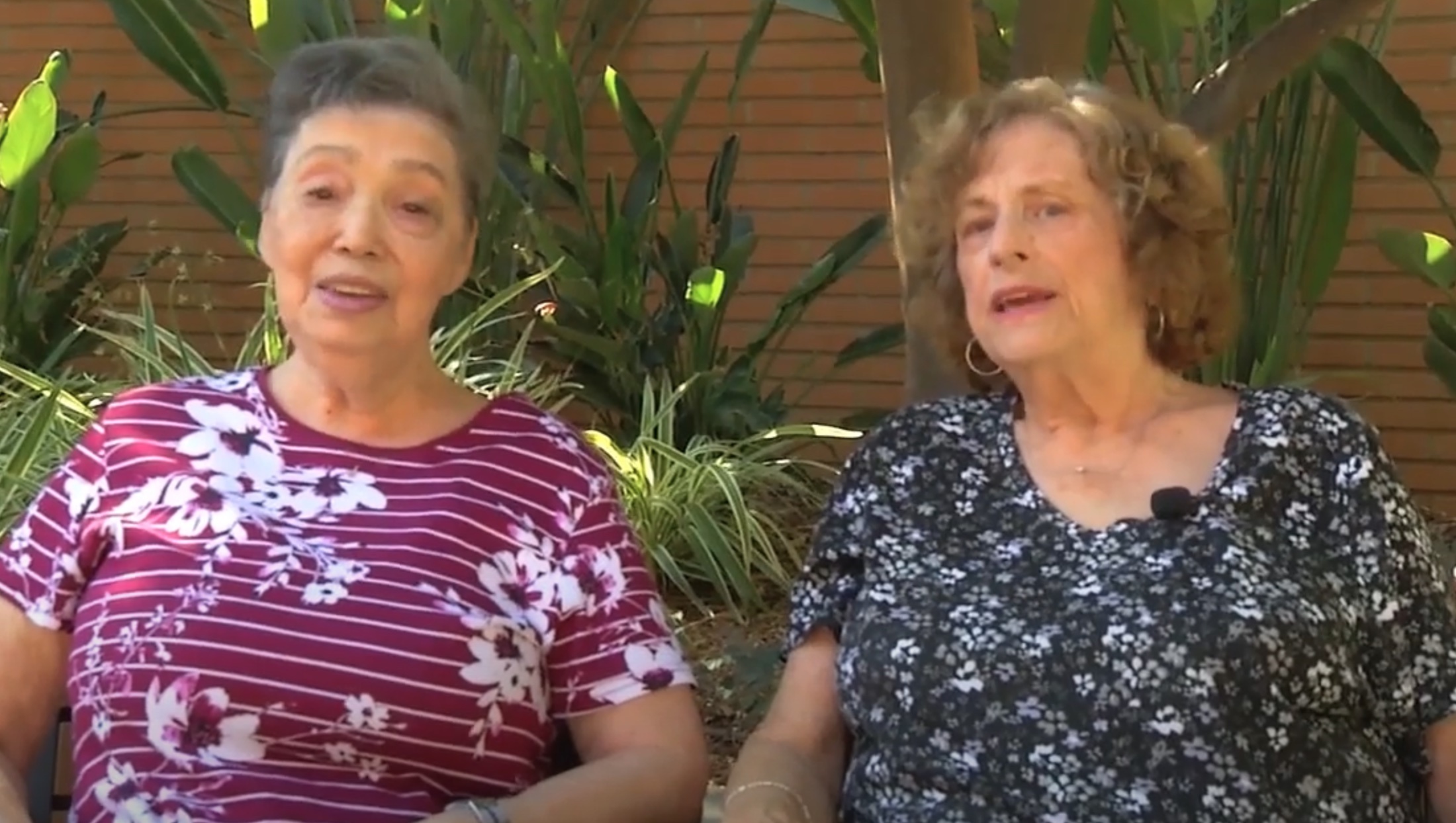 Two women sitting in chairs