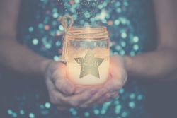 Woman holding a candle in her hands