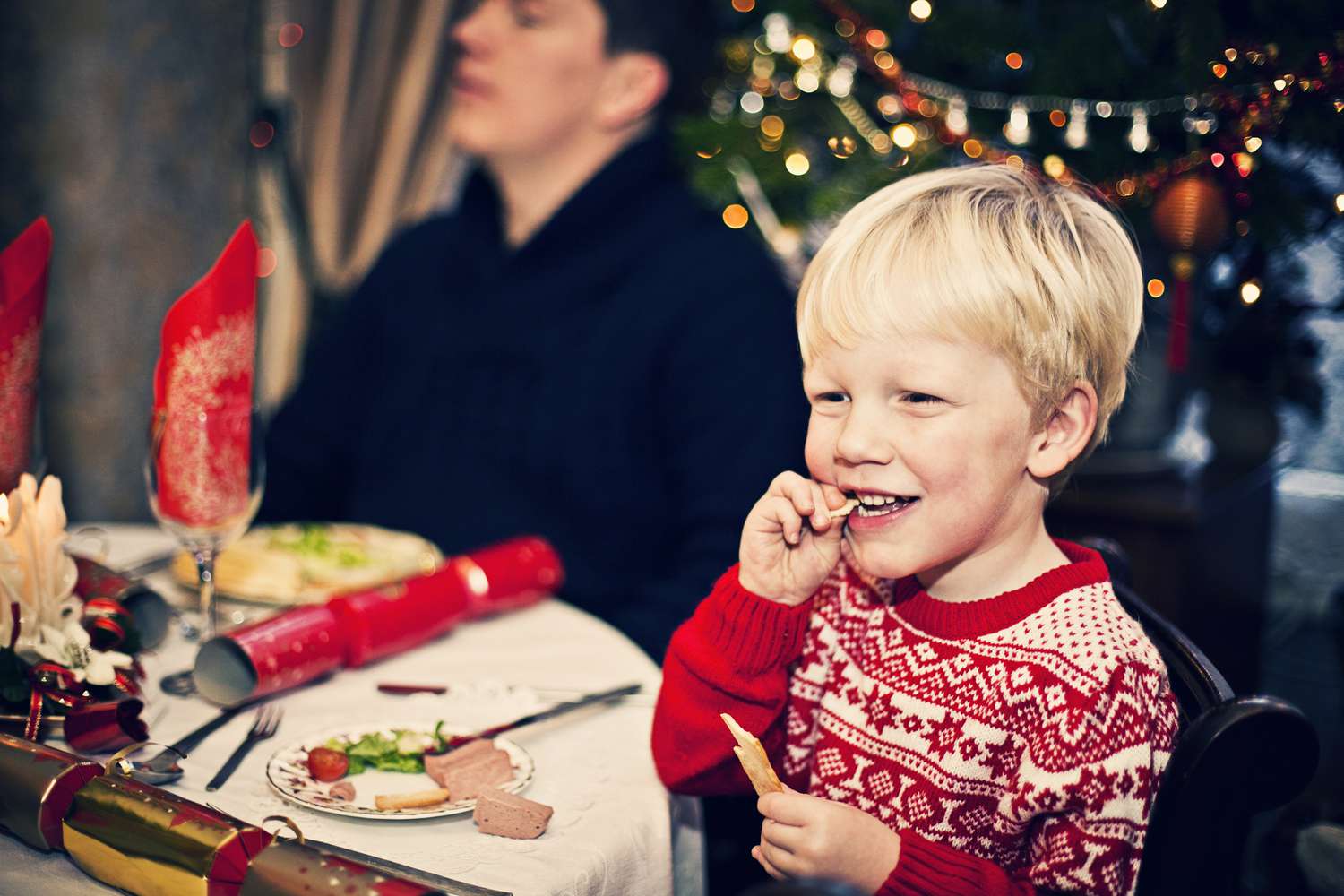 Child eating Christmas dinner.