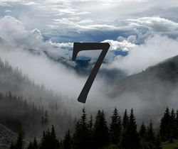 the number 7 among fog and clouds