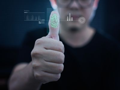 Picture of a man scanning his fingerprint on a scanner