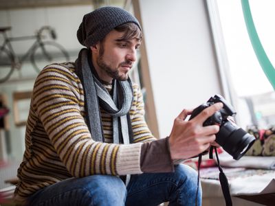 A photographer reviews his photos.