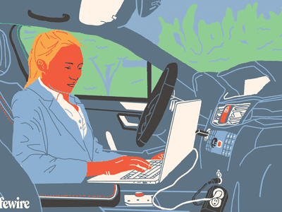 Illustration of a person using a laptop in their car via a power inverter