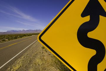 Curves ahead road sign