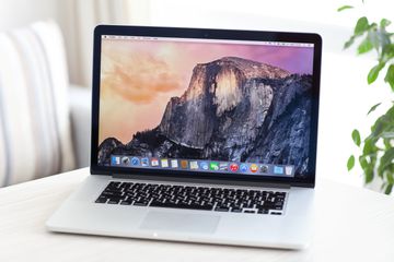 Apple laptop on white table