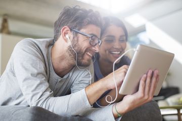 A couple using an iPad