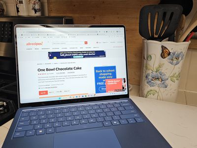 The Surface Laptop 7th Generation sitting on a kitchen counter with a browser open to a recipe site.