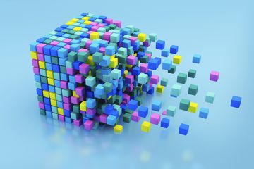 Small multicolored blocks assembling in large cube shape on blue background