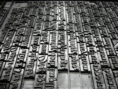 Metal typeface lined up into sentences