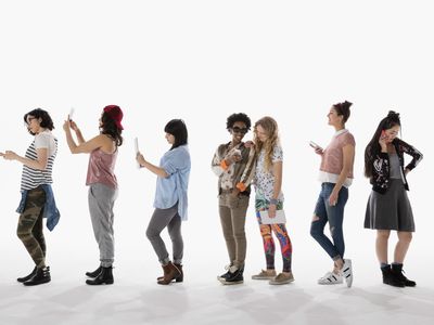 A group of people using iPhones