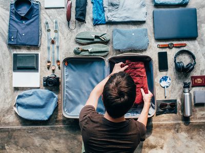 Man packing bag for trip