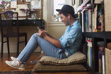 Teenager watching video on phone