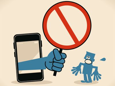 Business person standing in front of a big smartphone, a big hand from the mobile phone holding an empty prohibition sign