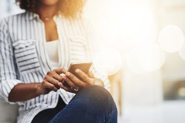 A Facebook user using a smartphone.