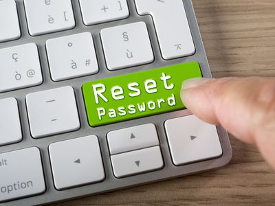 A big, green Reset Password button on a computer keyboard.