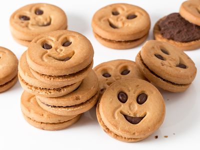 Pile of smiley sandwich cookies.