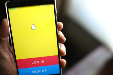 An image of the Snapchat login page on a smartphone.