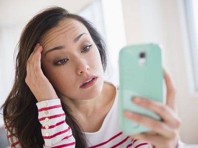 Woman using cell phone.