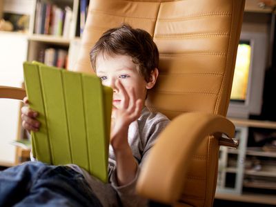 Young Boy Playing with Tablet