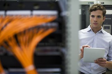 System administrator in a server rack