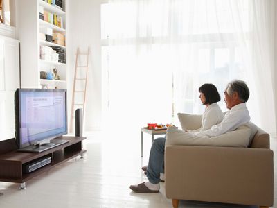 A couple turns off Samsung Voice Assistant on their TV.