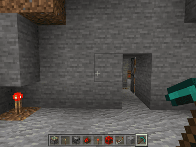 A secret doorway powered by a a Redstone torch in Minecraft