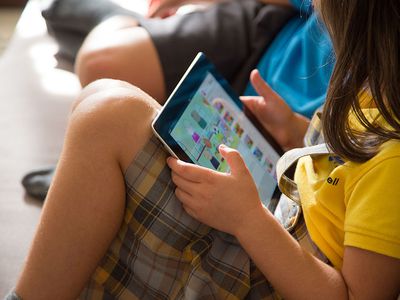 Child watching YouTube on a tablet