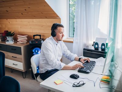 Man on computer focusing on work