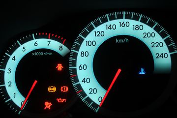 car dashboard with warning lights on