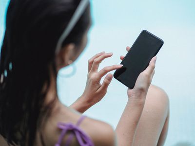 A woman looking at a smartphone.