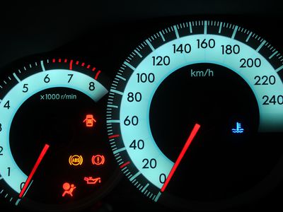 car dashboard with warning lights on