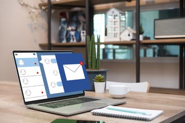 An illustration of an email icon coming out of a laptop
