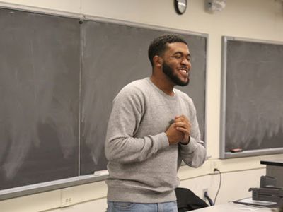 Jehron Petty speaking in a classroom.