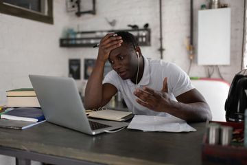 Image of man struggling with videoconferencing