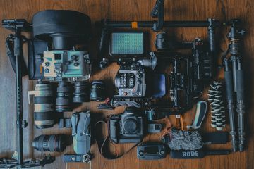 An array of camera gear laid out on a tabletop. 