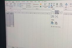 Zoomed in photo shows Excel with Data in column A and B, and Insert > Scatter (X,Y) Chart menu icon selected