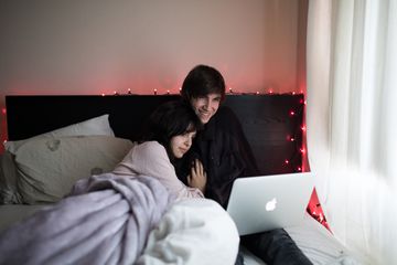 Couple watching streaming media on laptop