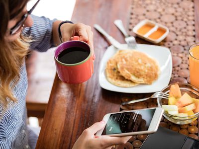 Streaming Hallmark Channel on a phone at breakfast.