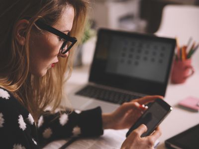 Woman focusing on phone