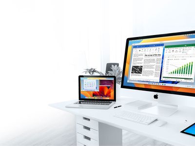 A Mac desktop and laptop computer running Windows in a virtual PC.