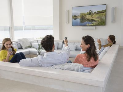 A family watches a new TV.