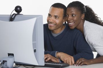 Couple using a webcam on a computer